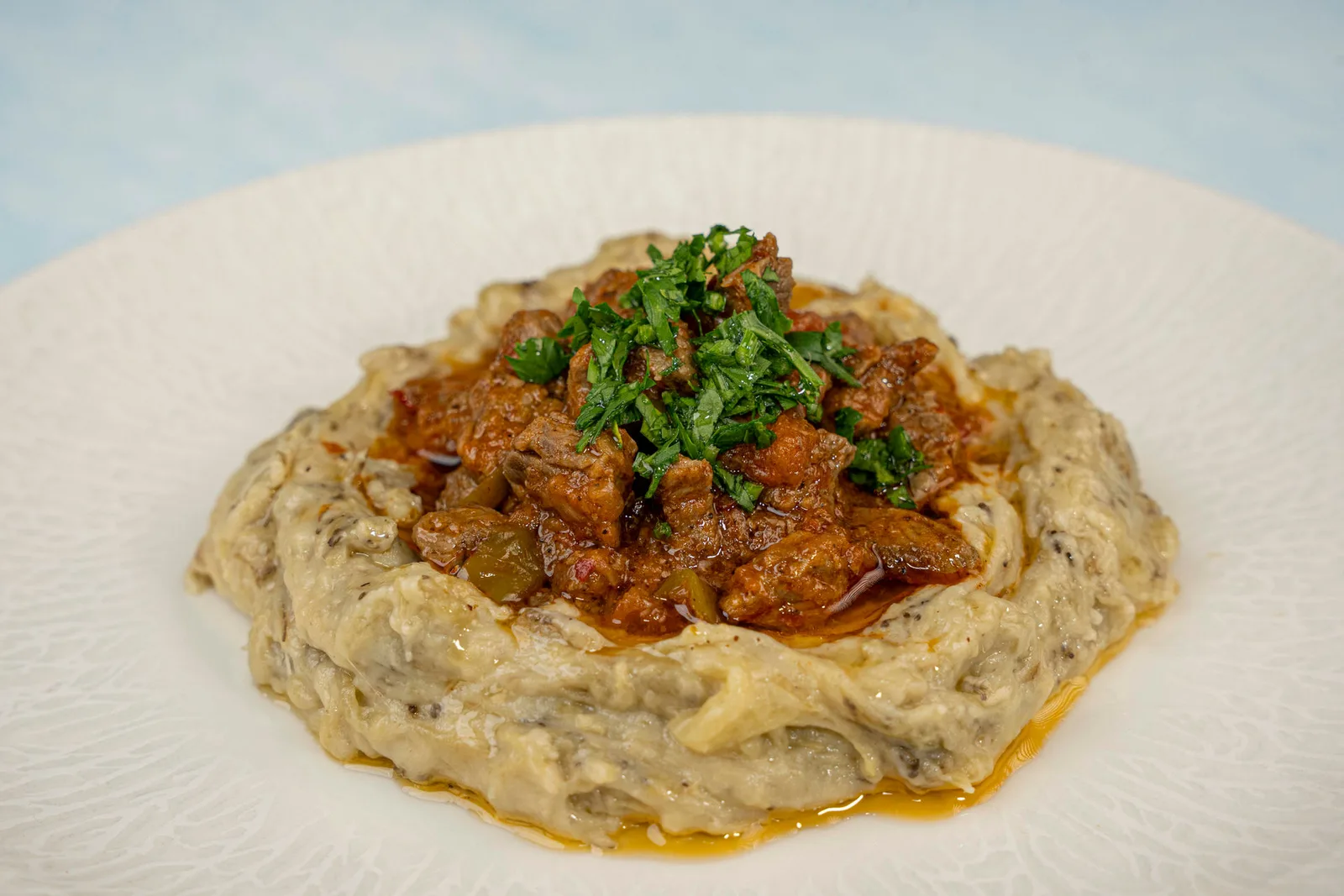 Ali Nazik — smoked aubergine purée topped with sautéed beef, served at Ebruli's Kitchen