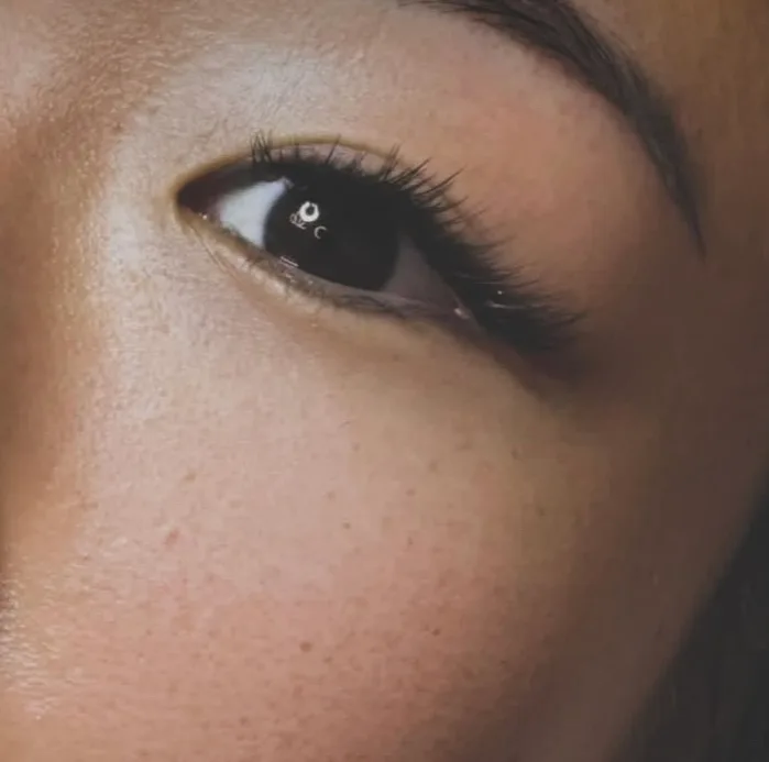 Close-up of softly defined lashes and a groomed brow