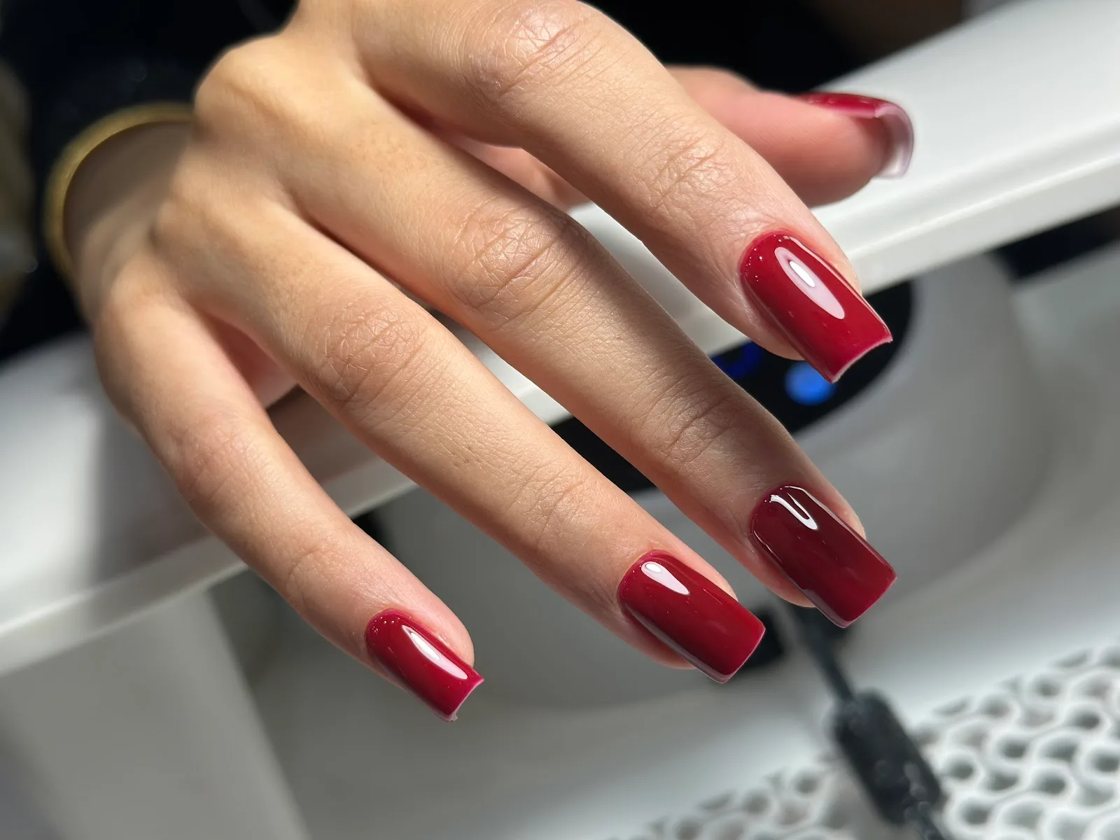 Glossy deep-red square manicure