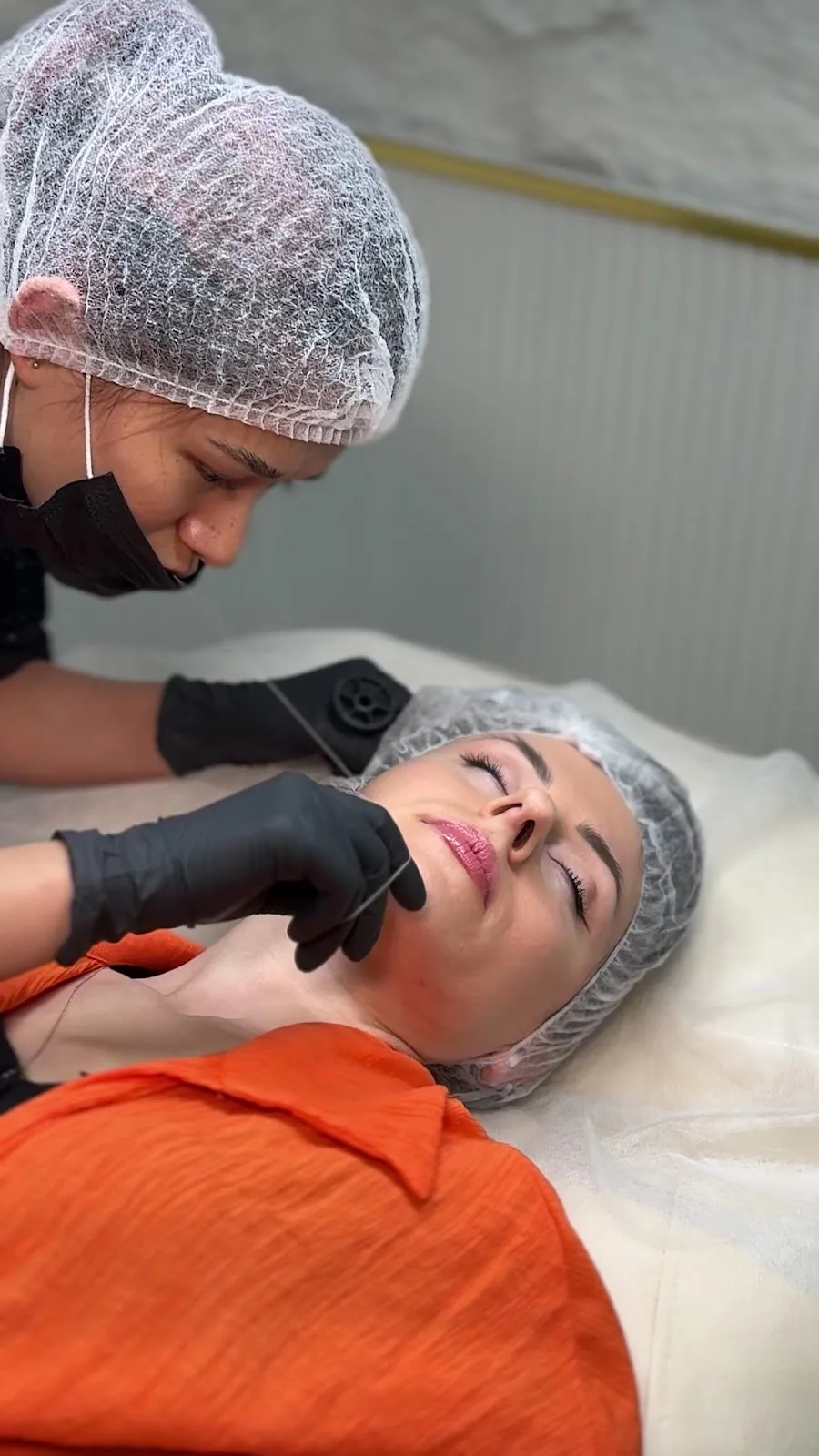 A facial and threading treatment in progress
