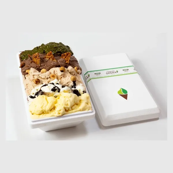 A multi-flavour family tub of gelato with its takeaway box