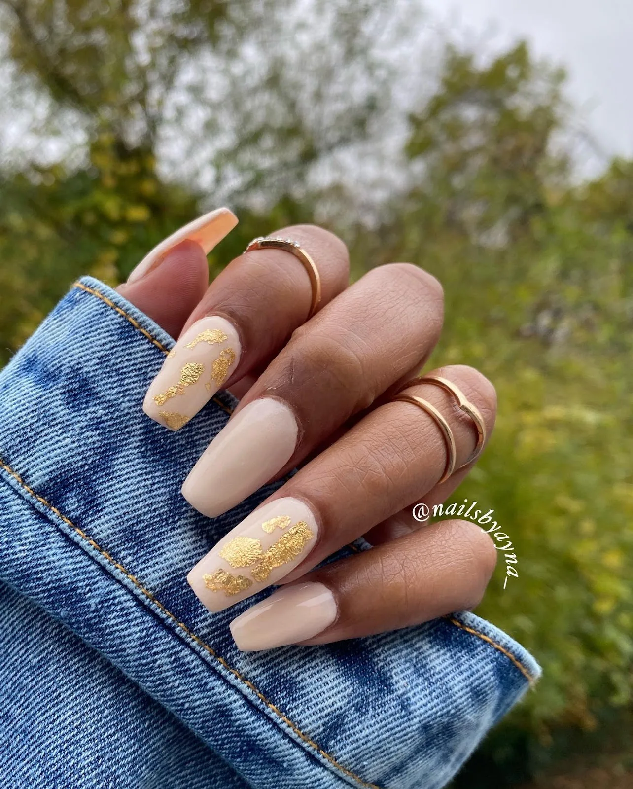 Nude nails finished with gold leaf detail