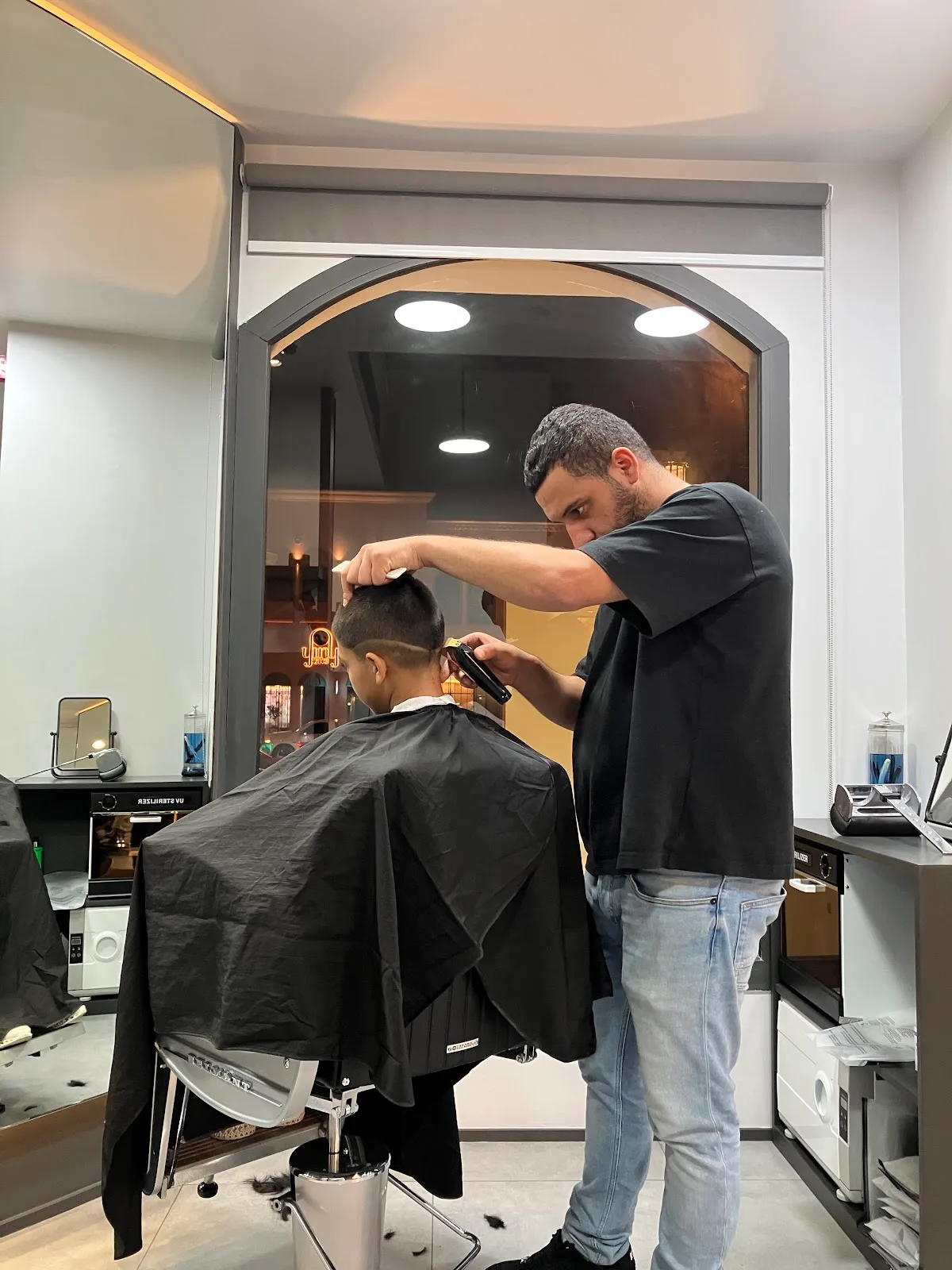 A Dyson hair dryer mounted at a styling station