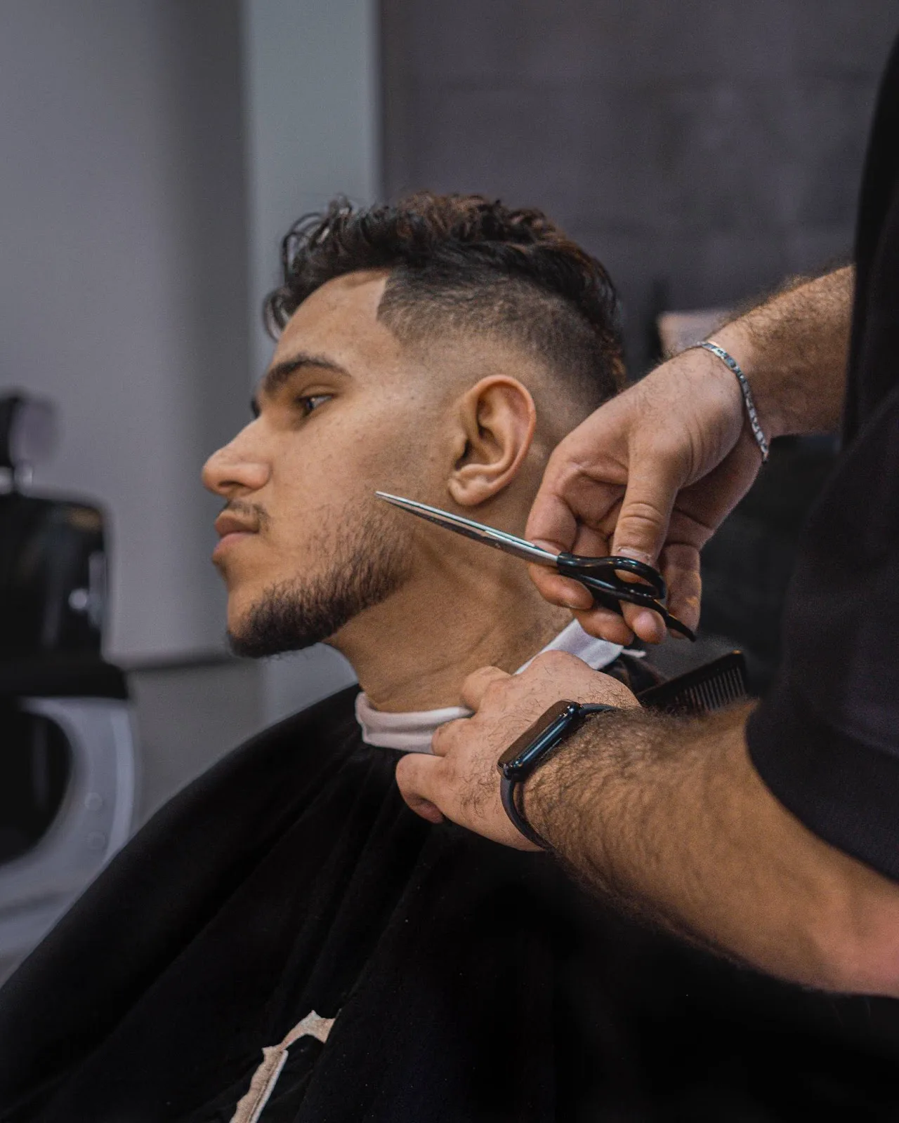 Scissor work along the side profile of a beard