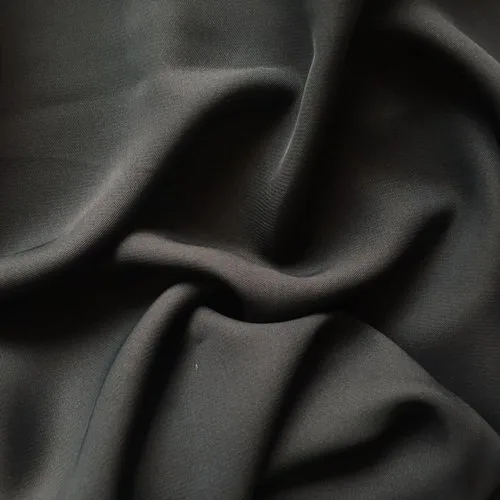 Folds of soft black abaya fabric