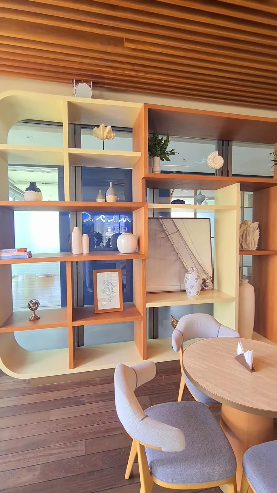 Nautical-themed display shelves inside the caffè