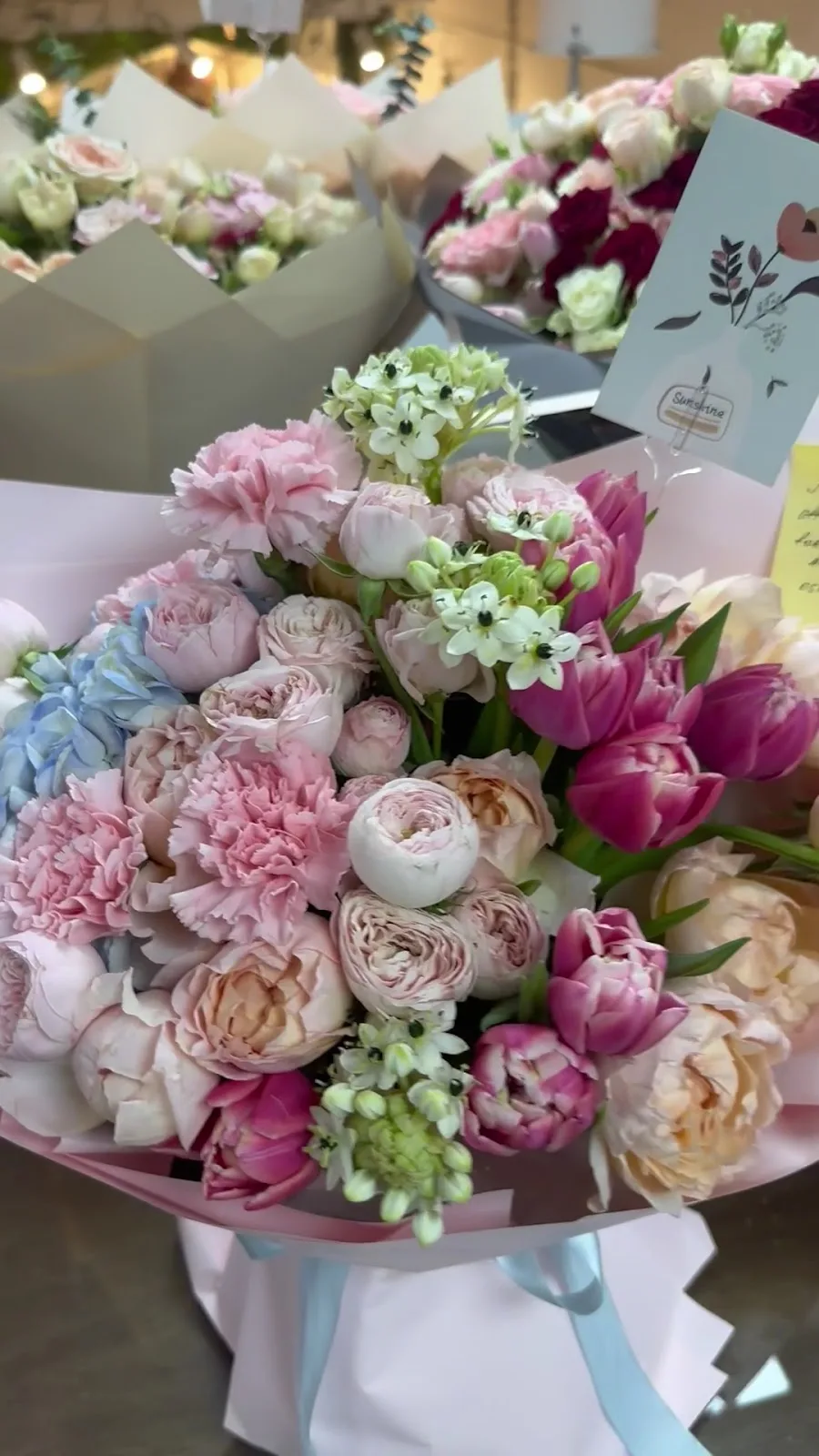 Pastel seasonal bouquet with tulips, carnations and garden roses