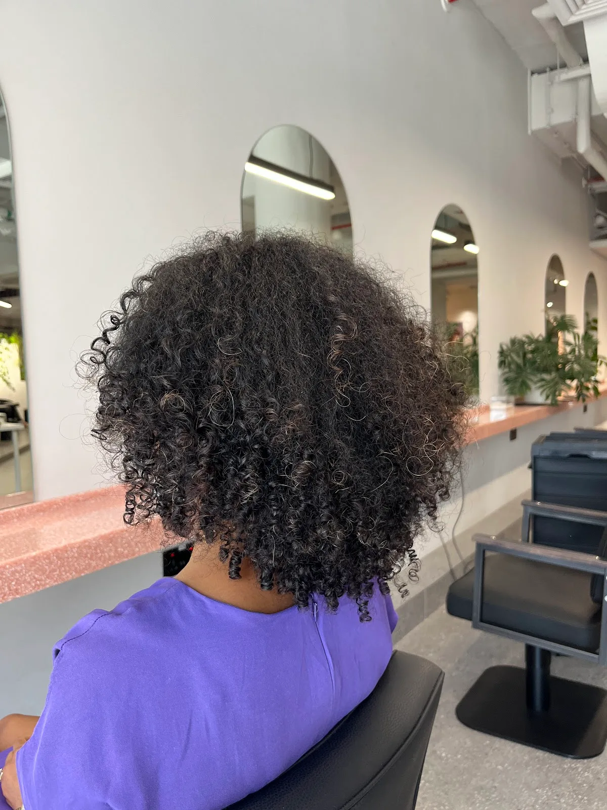 Back view of freshly shaped natural curls