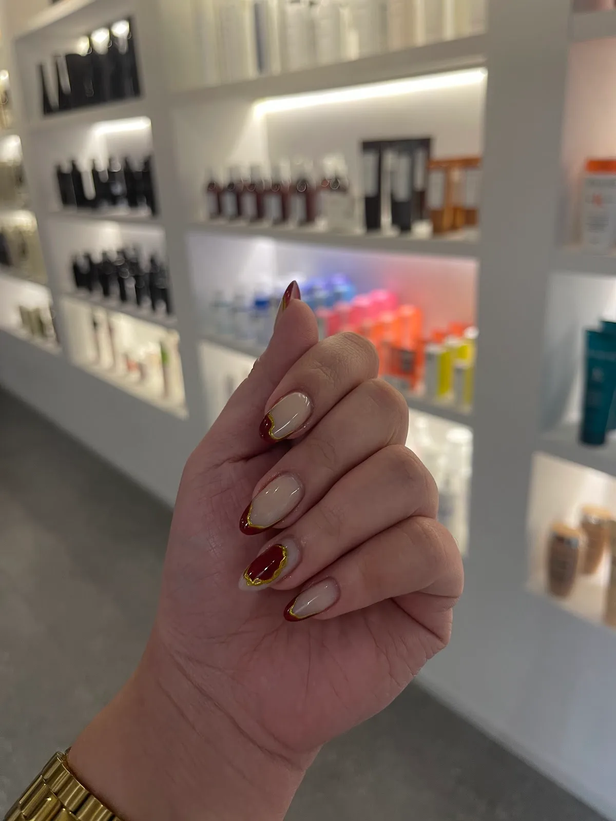 Red and gold nail art detail