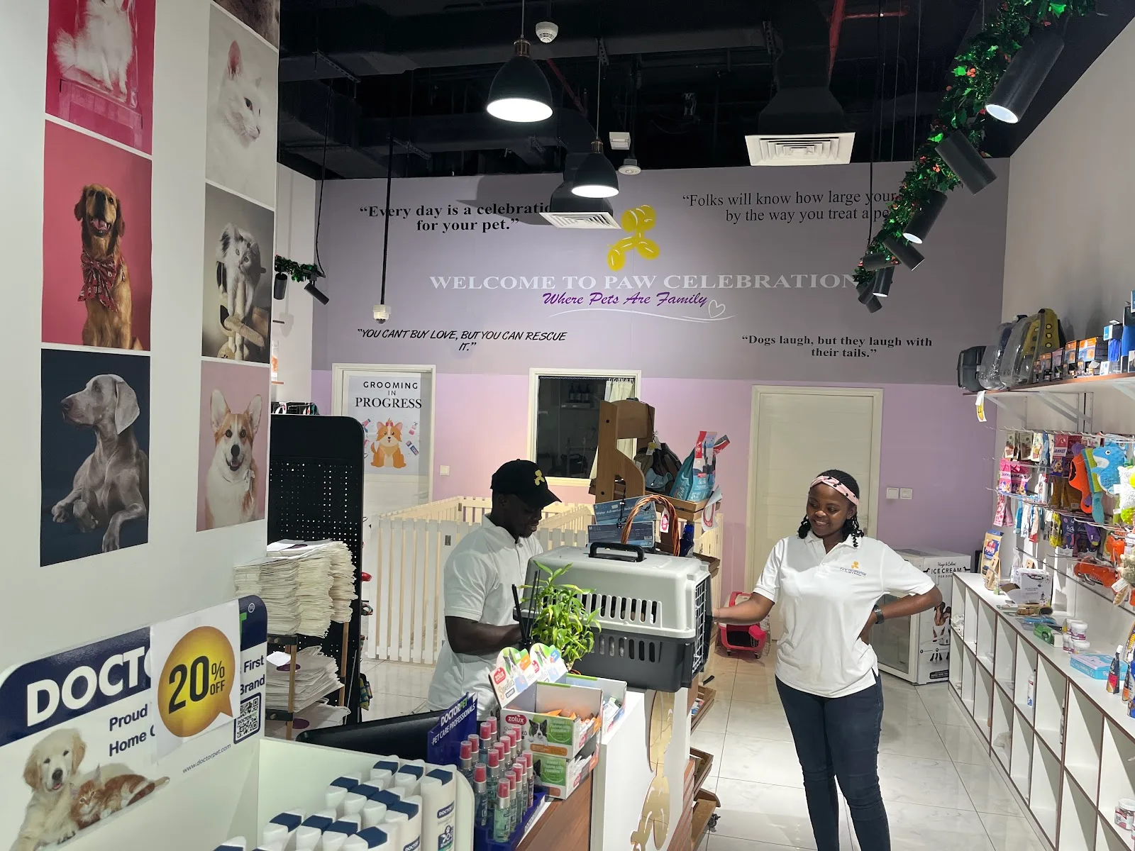 Inside Paw Celebration with the Where Pets Are Family wall and boutique shelves