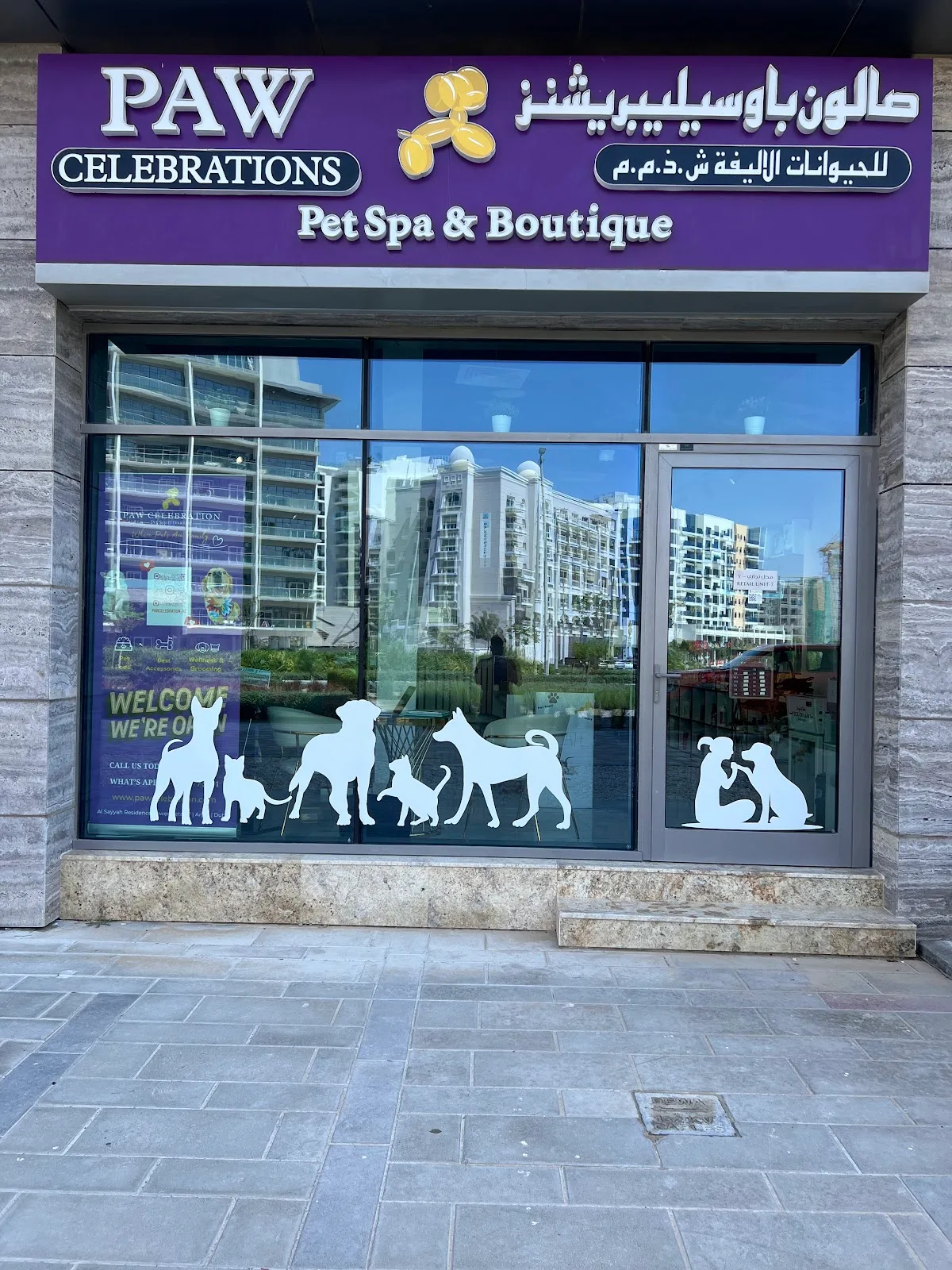 The purple Paw Celebration Pet Spa & Boutique storefront in Arjan, Dubai