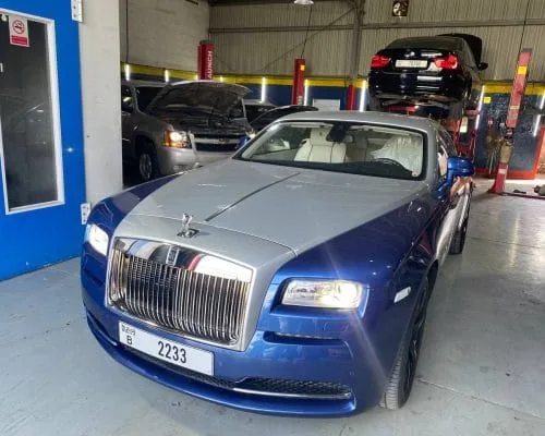 Blue and silver Rolls-Royce Wraith inside the garage