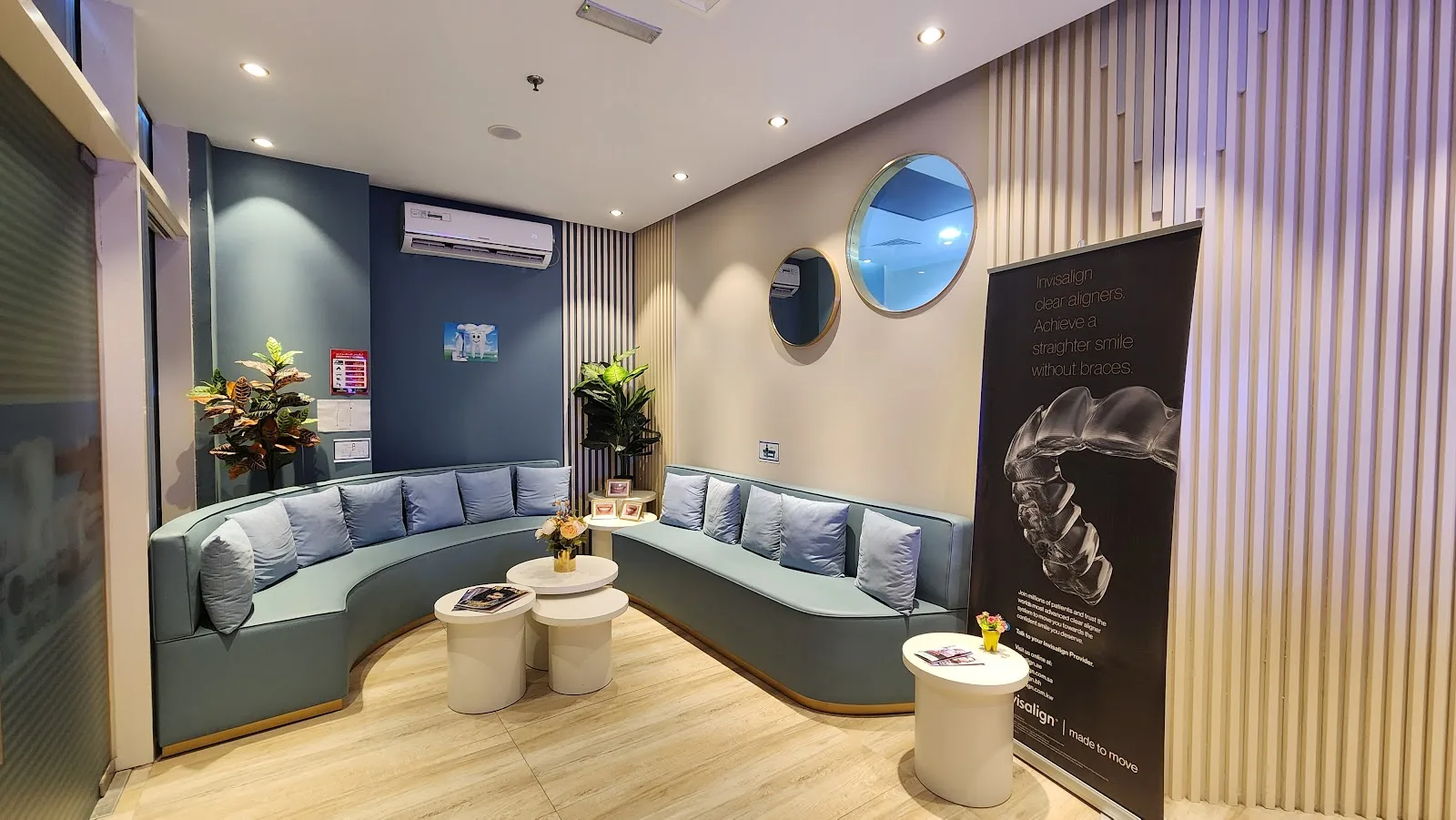 Waiting lounge with curved sofas and treatment information