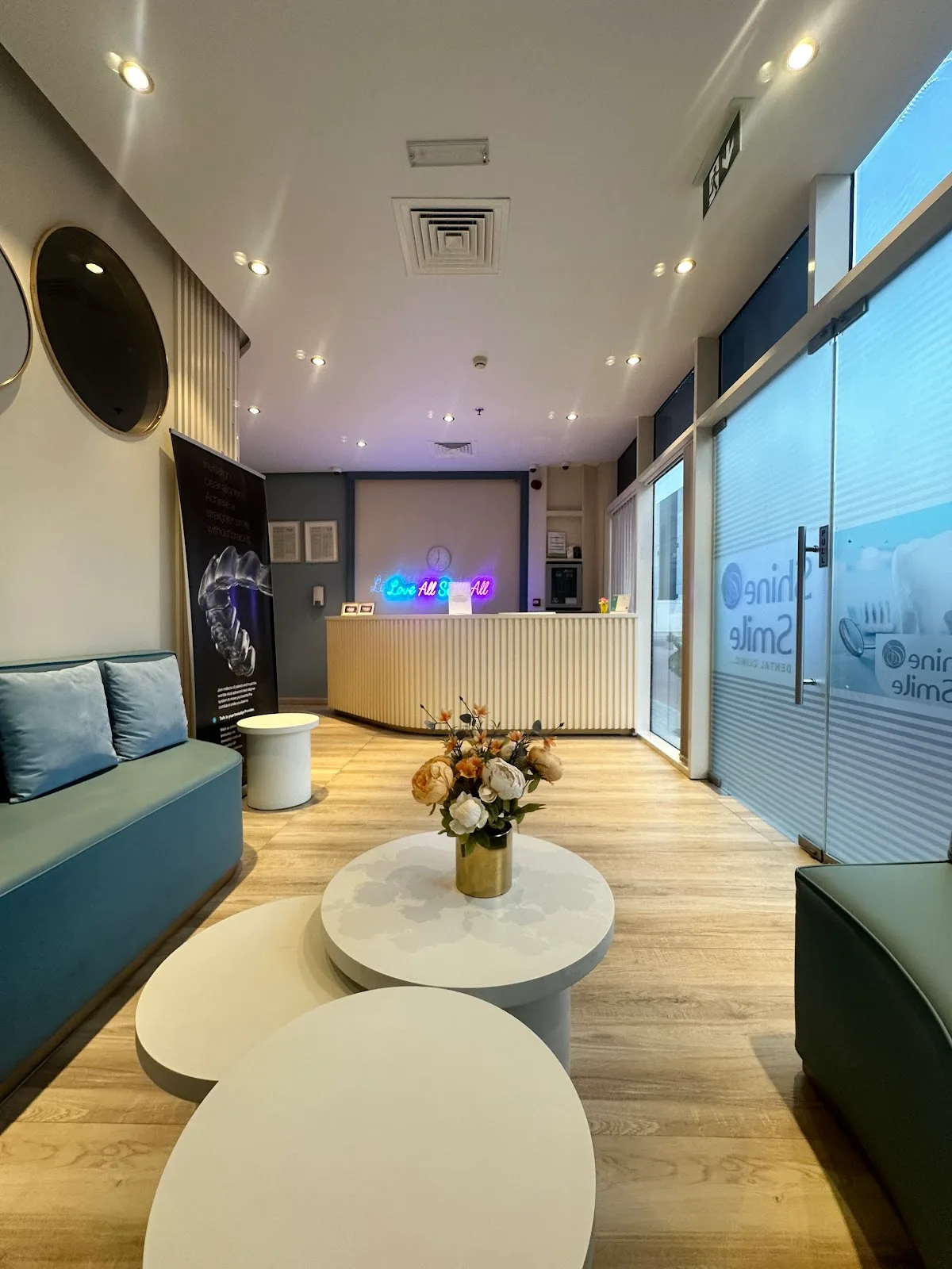 Shine and Smile Dental Clinic reception and waiting lounge with curved seating in Jumeirah Village Circle