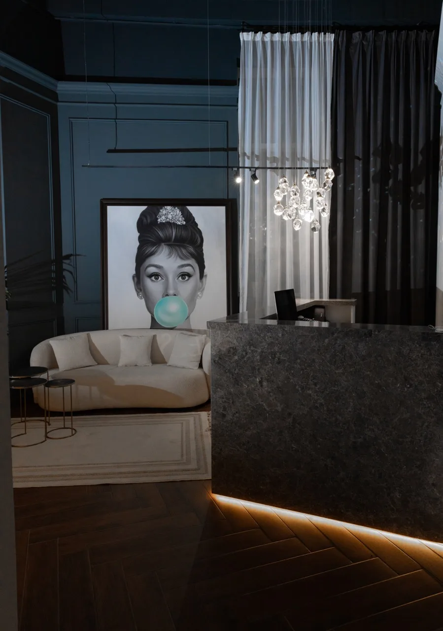 Reception with crystal chandelier and marble desk
