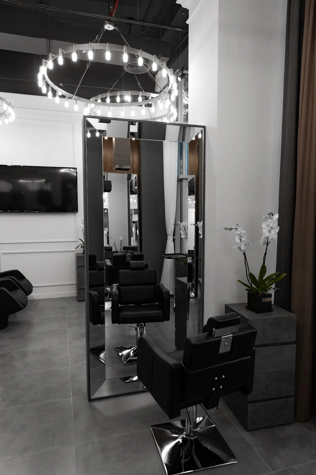 Hair styling station with tall mirror