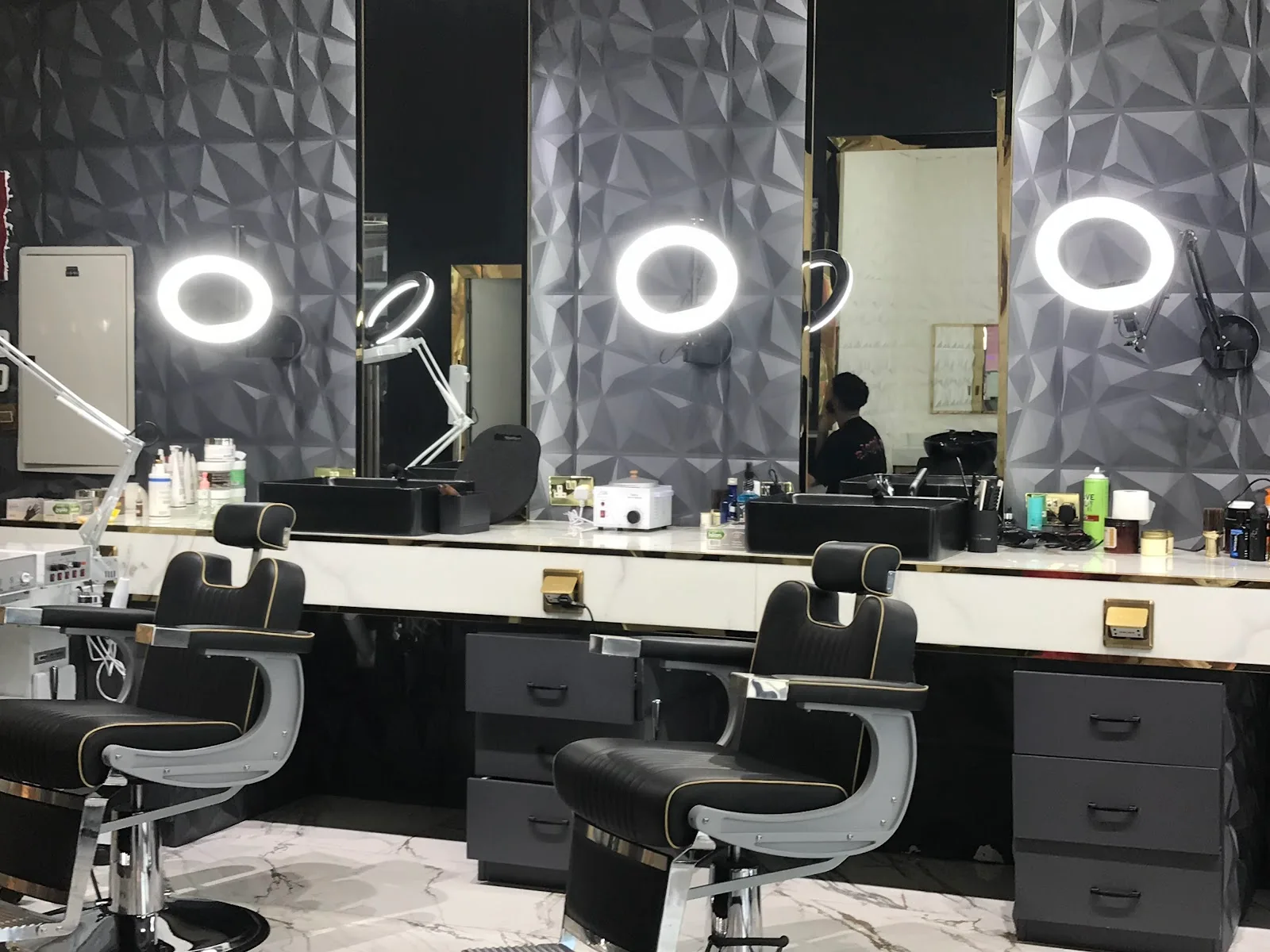 Styling stations with mirrors and ring lights at Barber Club Dubai