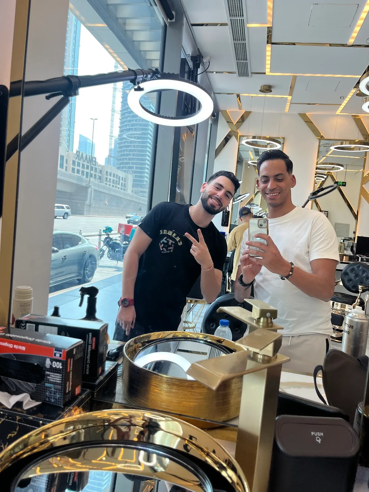 A barber and guest at Barber Club Dubai