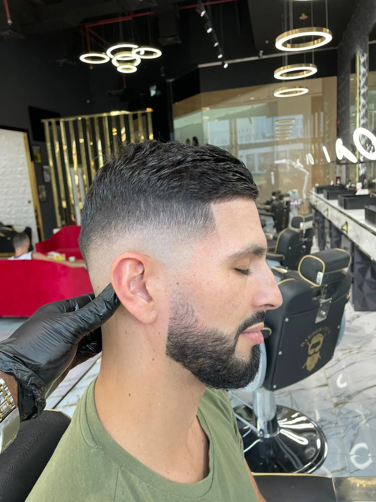Skin fade with a sharp beard line-up