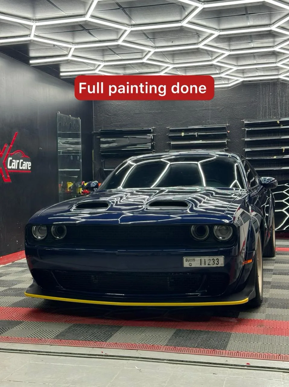 A dark muscle car after a full paint refinish