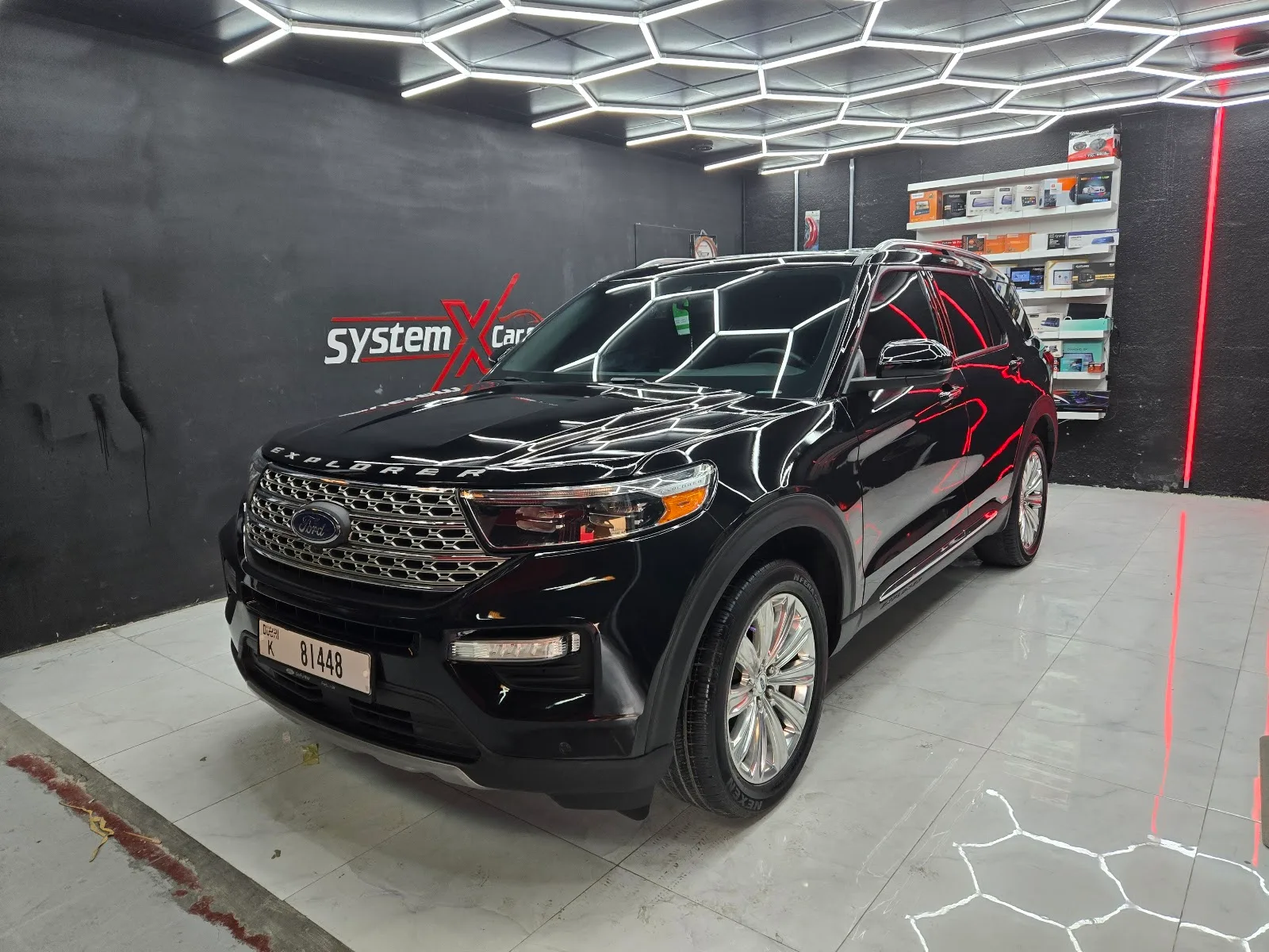 A black SUV detailed in the System X Car Care bay