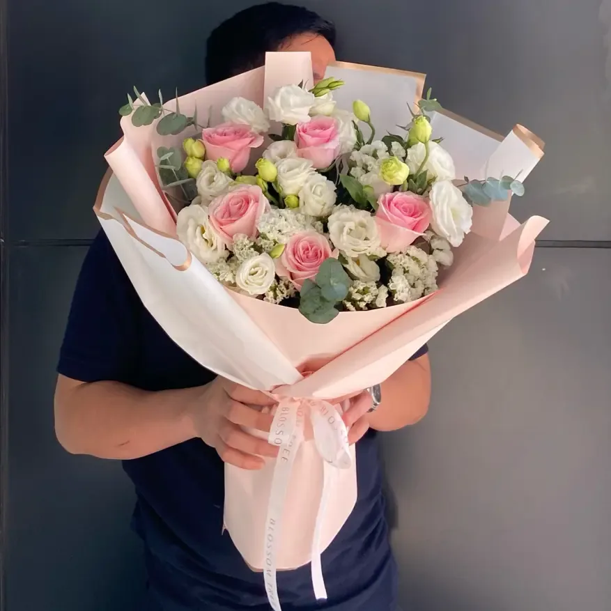 Tall pink and white wrapped bouquet