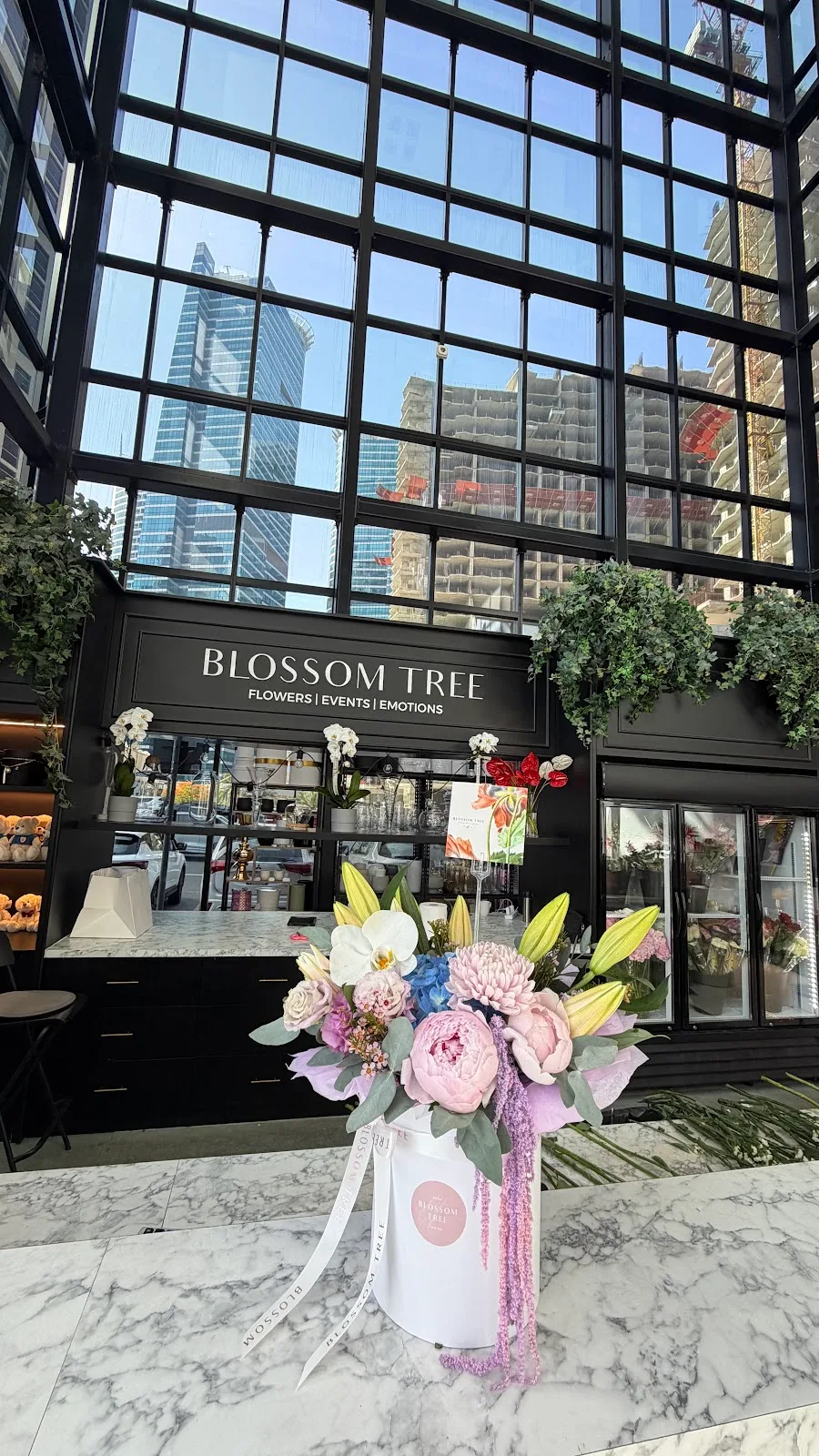 Blossom Tree shopfront with an arrangement on the counter