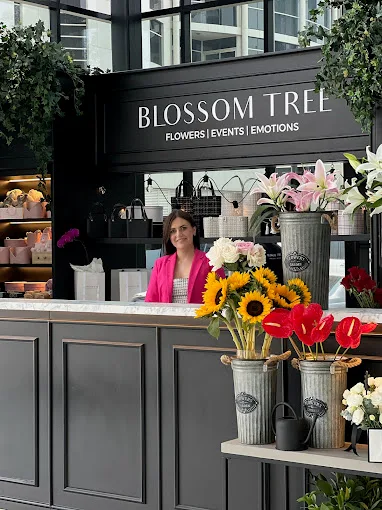 The Blossom Tree counter with fresh flowers and sunflowers