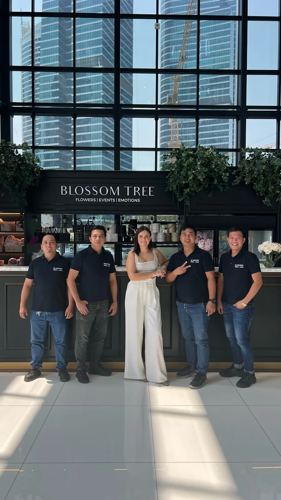 The Blossom Tree team in front of the shopfront