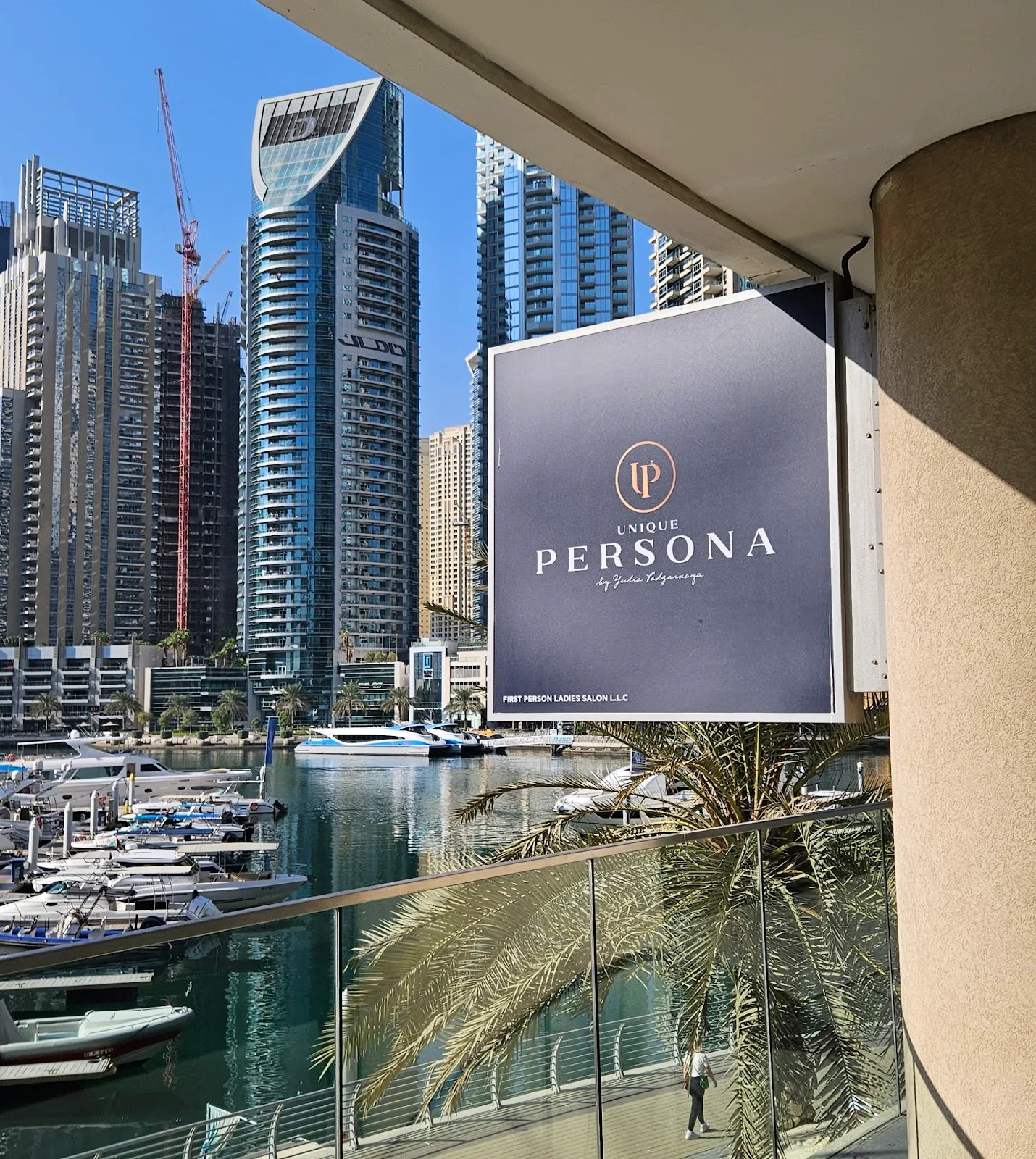 PERSONA salon signage overlooking the Dubai Marina waterfront