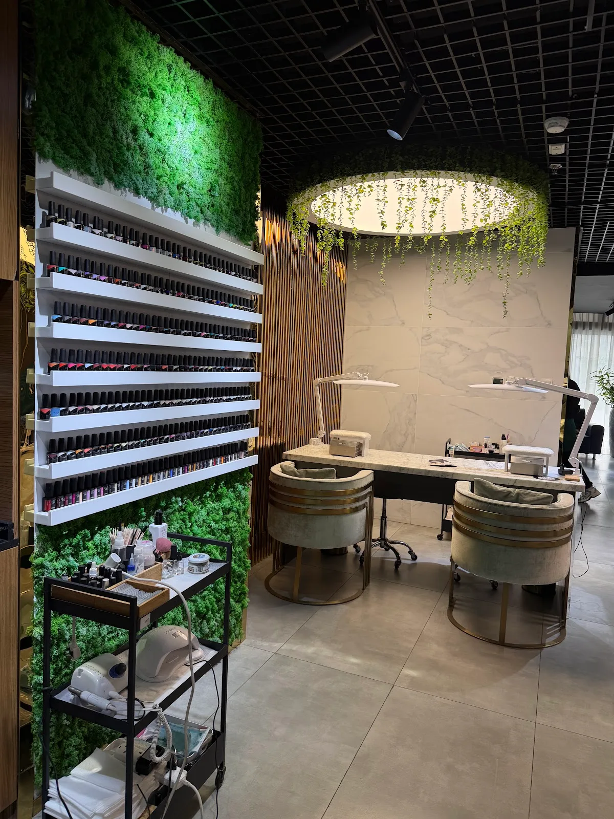Nail bar with a full colour wall and marble stations