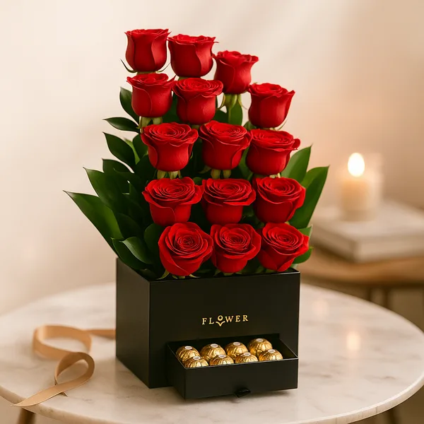 Tall arrangement of red roses in a black box with a pull-out chocolate drawer
