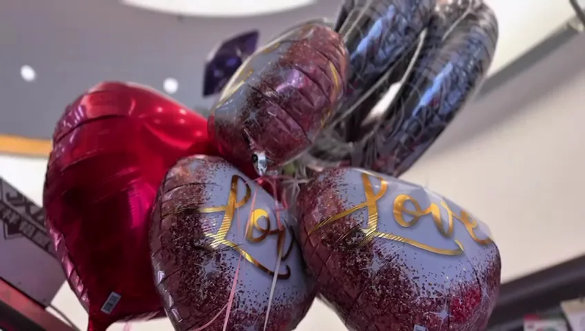 Foil love-themed balloons in red and rose gold