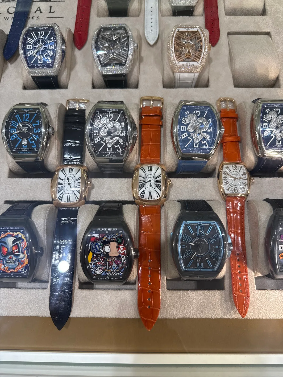 Display case filled with Franck Muller Vanguard watches in varied colours