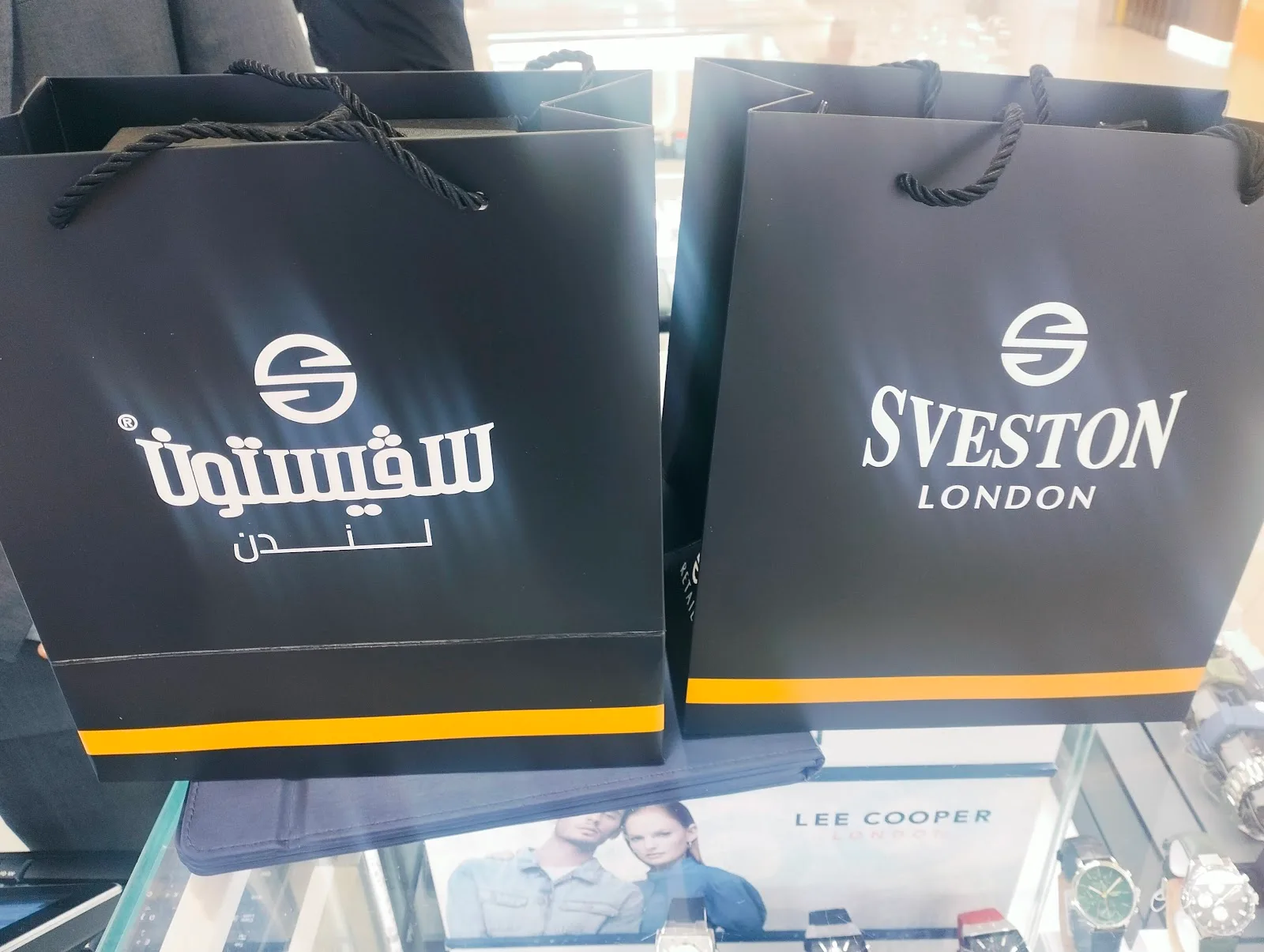 Two black SVESTON LONDON shopping bags