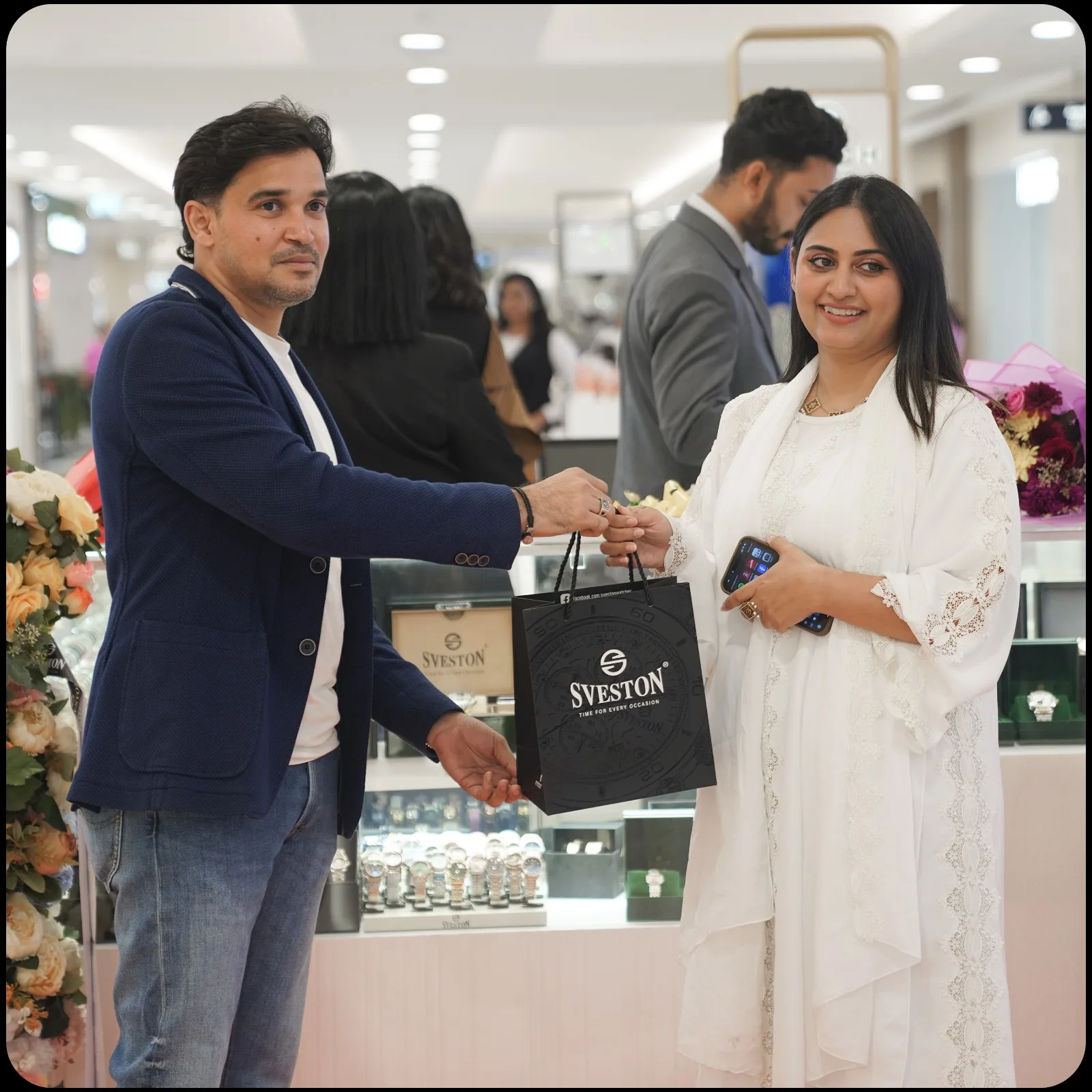 A customer receiving a SVESTON LONDON bag