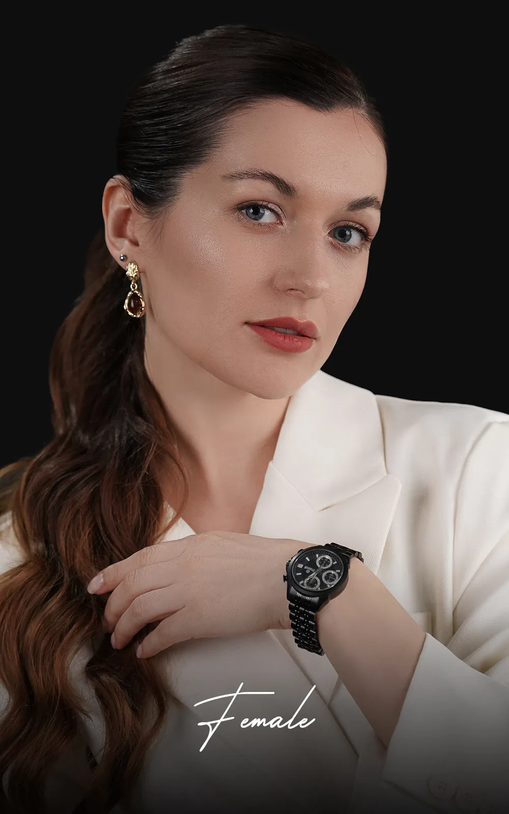 Woman wearing a black chronograph watch
