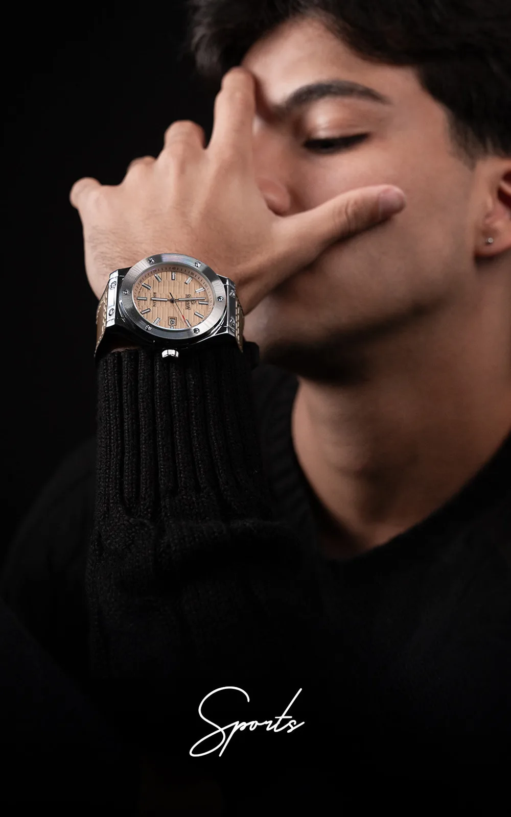 Sports watch with a champagne dial on a man's wrist