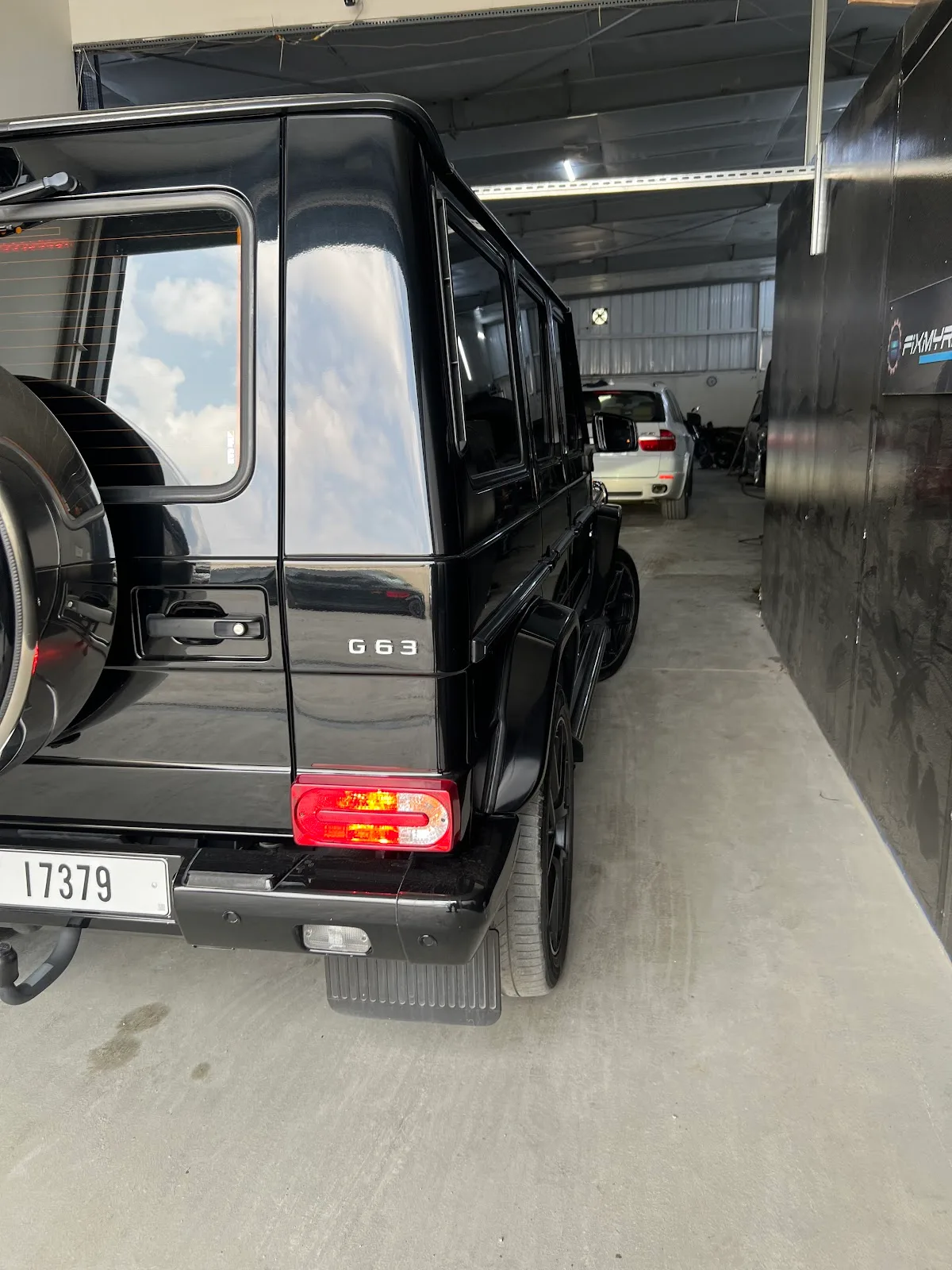 Black Mercedes-Benz G 63 parked in the workshop