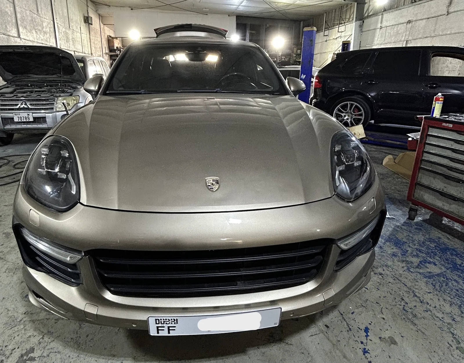 Porsche Cayenne front view in the workshop