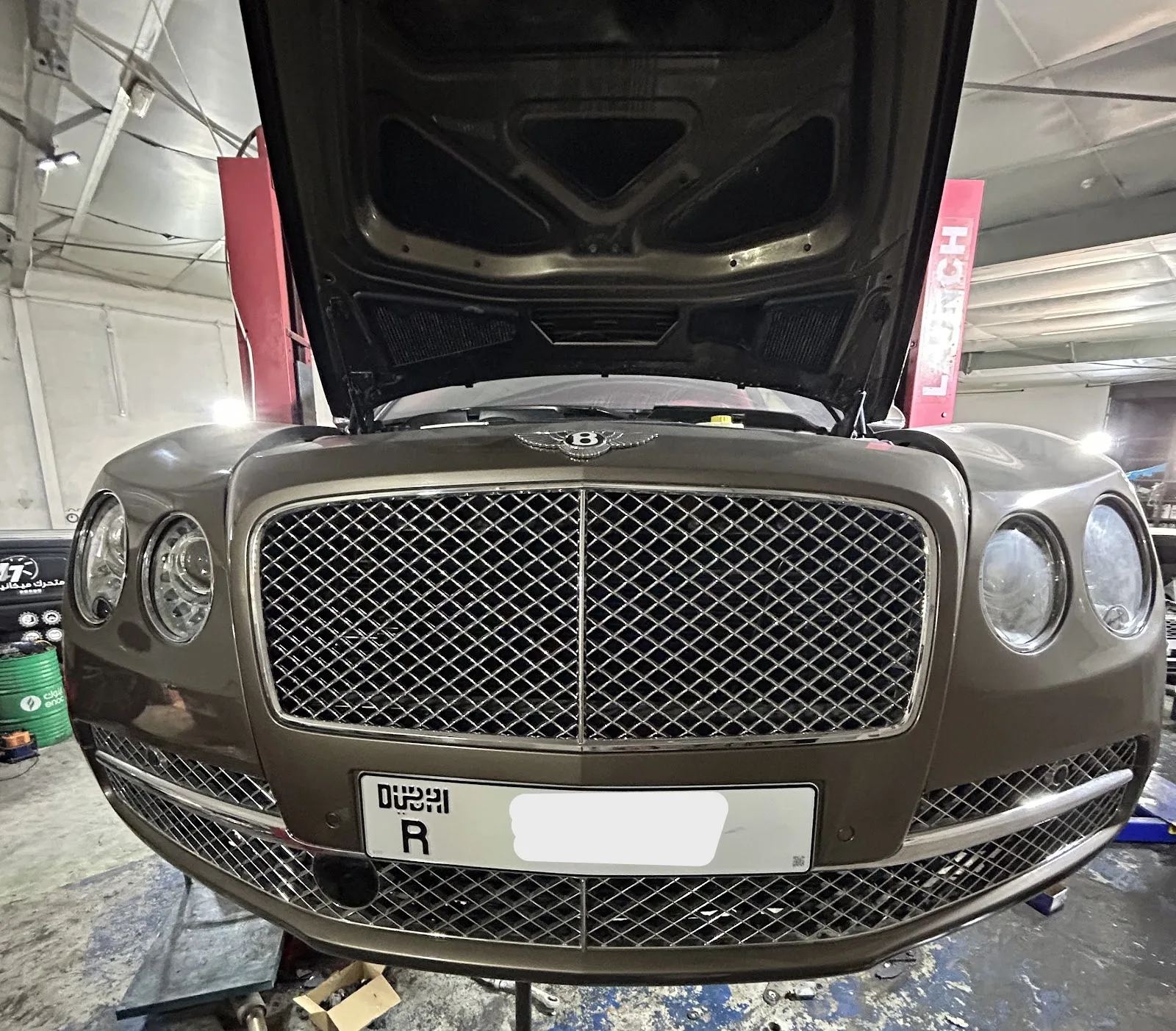 Bentley Flying Spur raised on the lift, front view