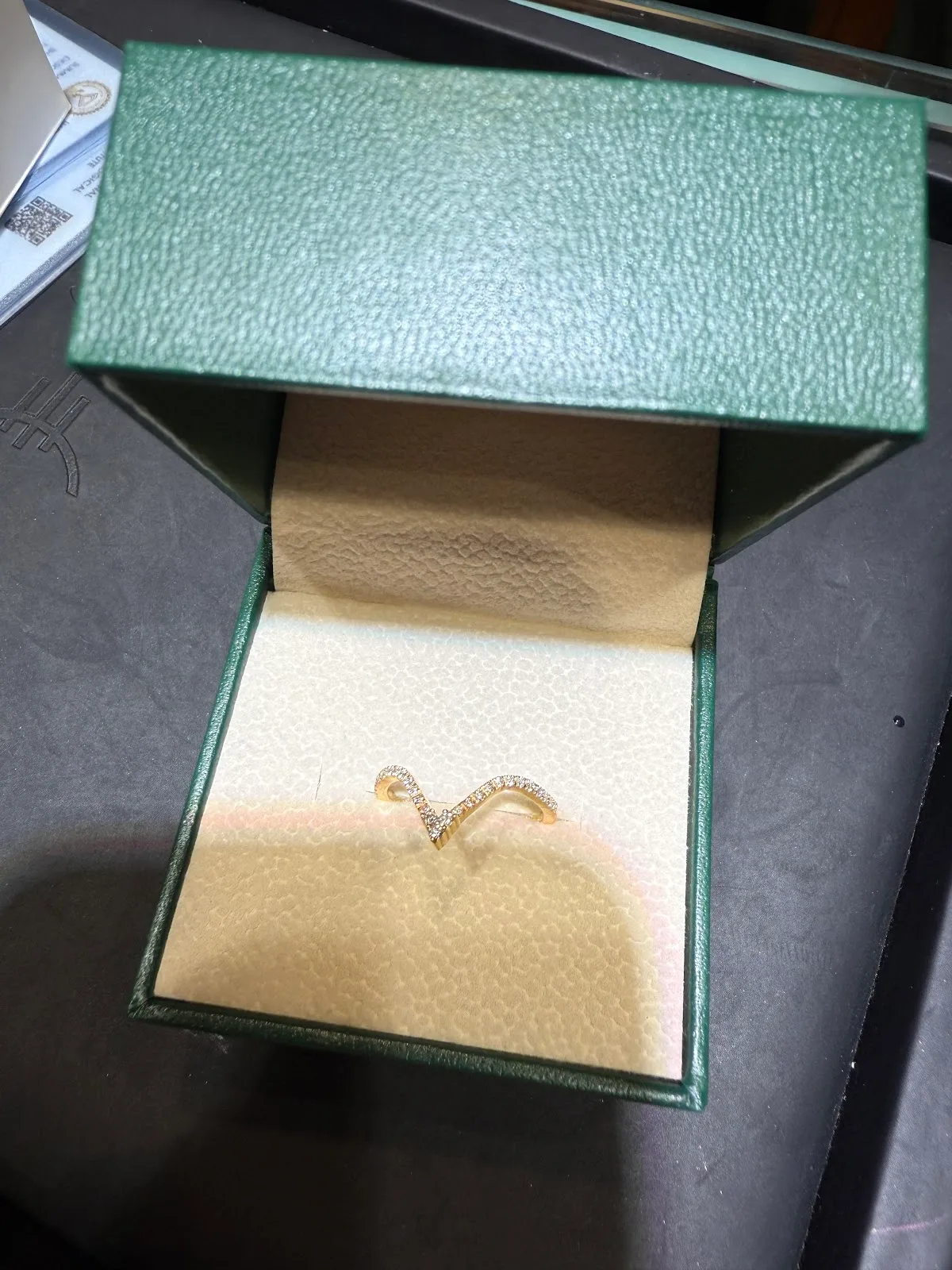 Diamond ring presented in a green Thangals jewellery box