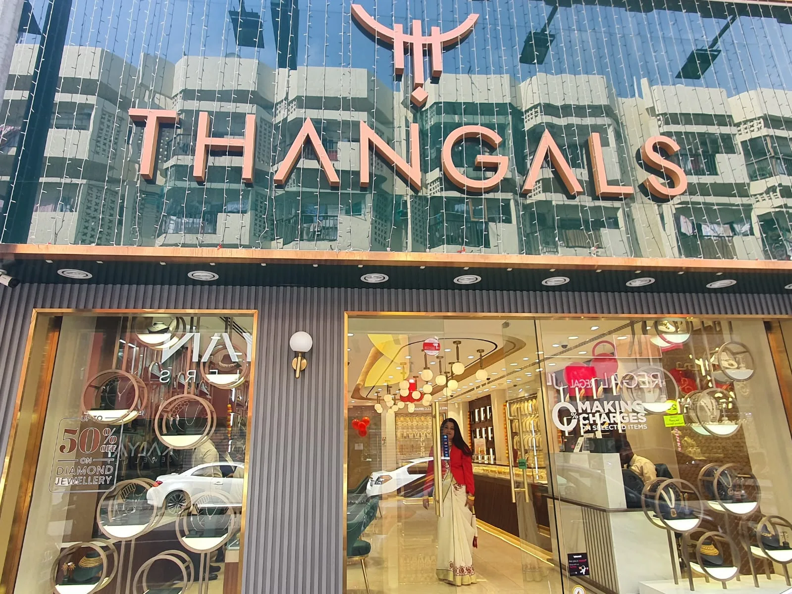 Thangals glass storefront with the wordmark above the entrance during the day