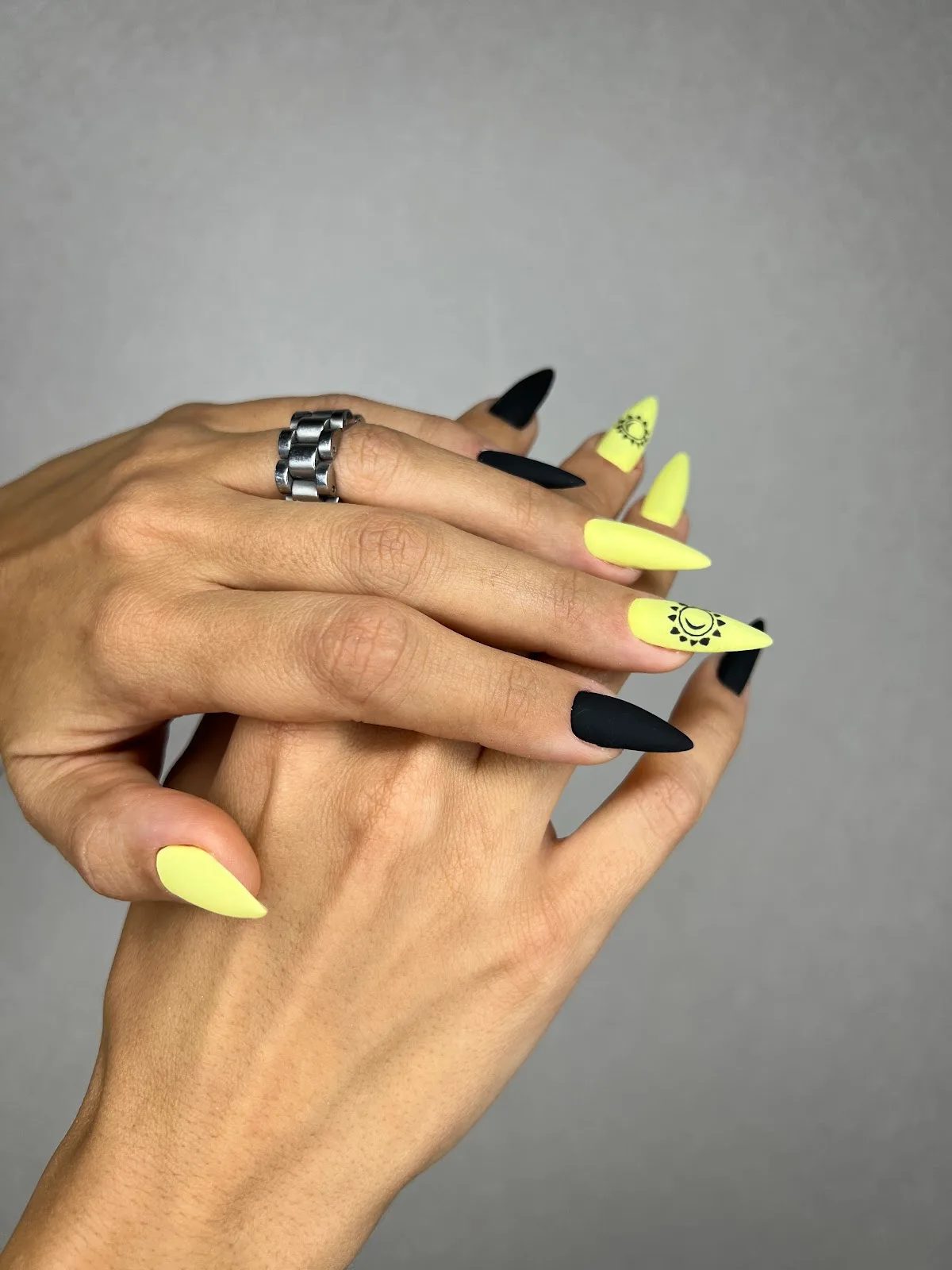 Yellow and black stiletto nails