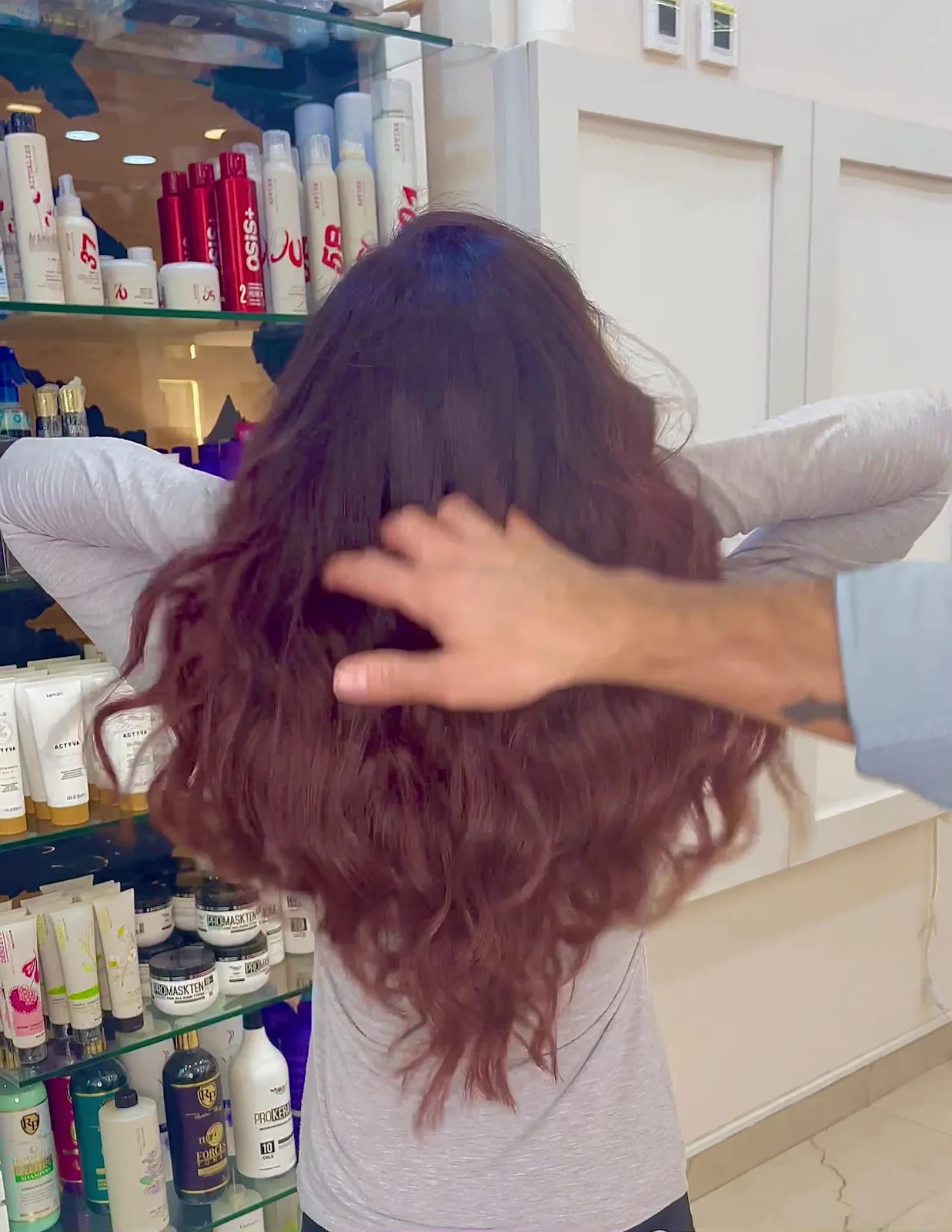Long auburn waves in the salon