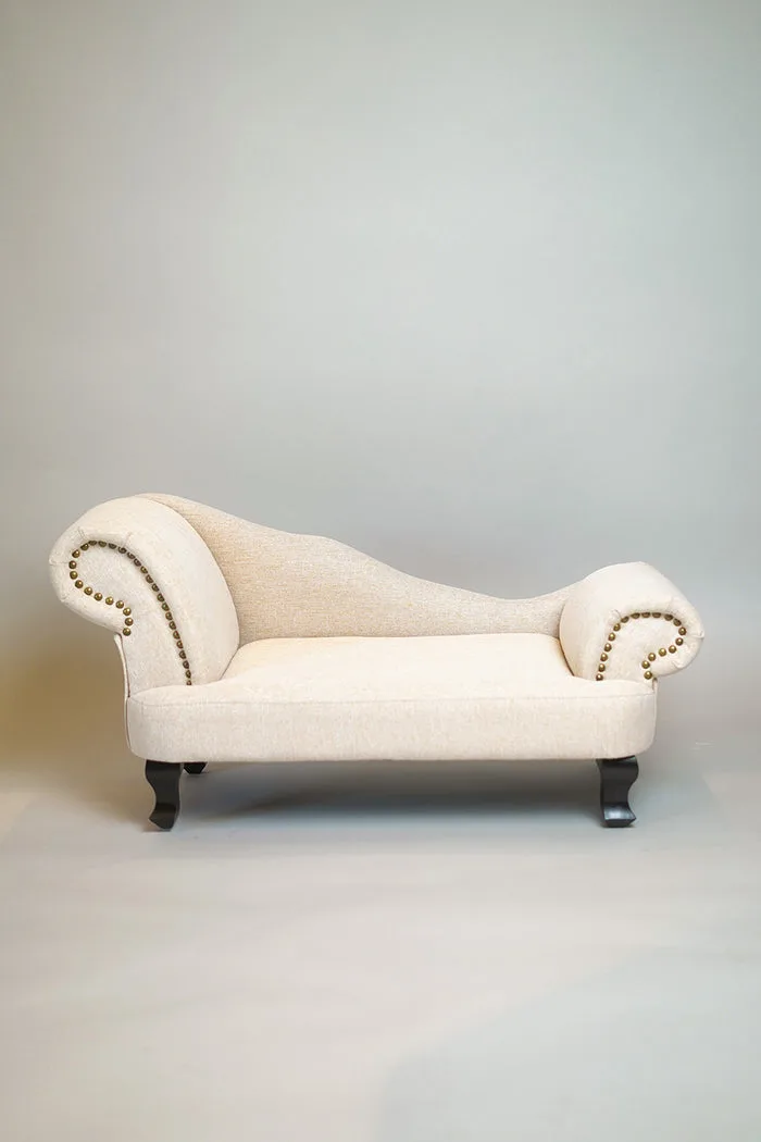 A cream upholstered miniature pet chaise