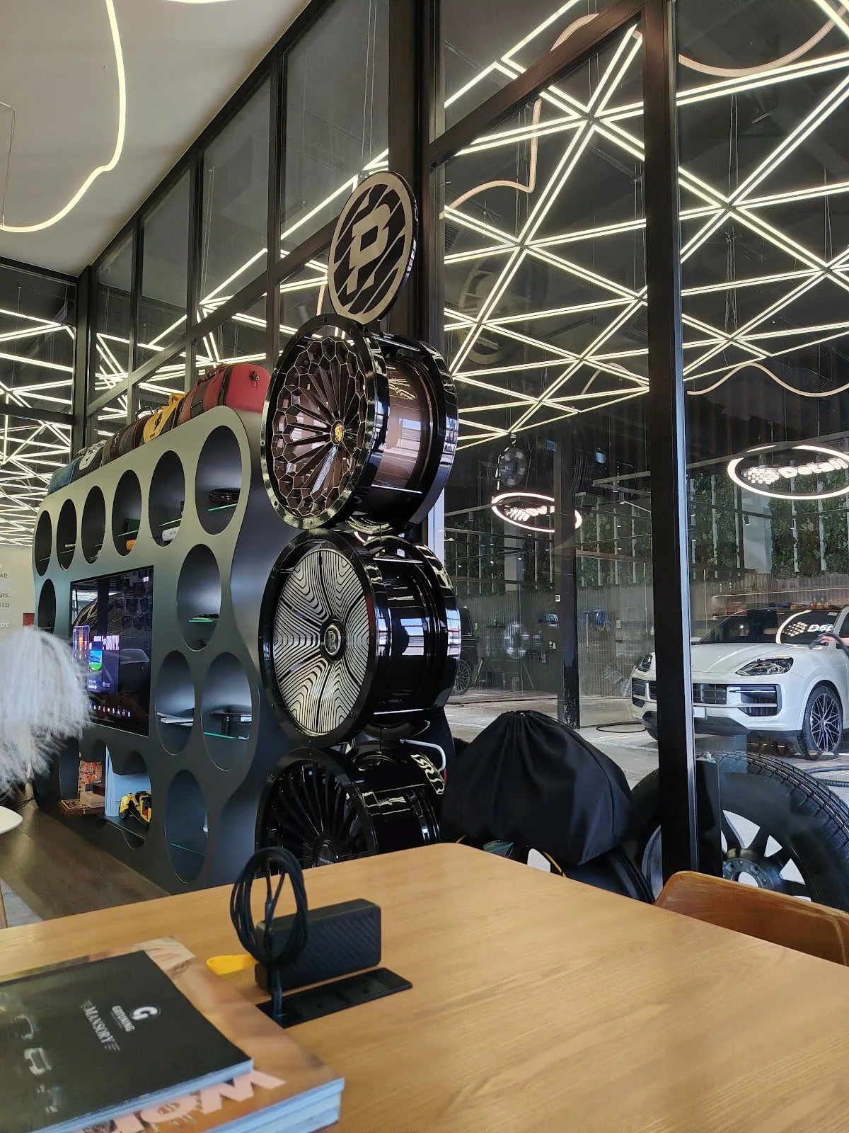 A wall display of forged alloy wheels inside the studio
