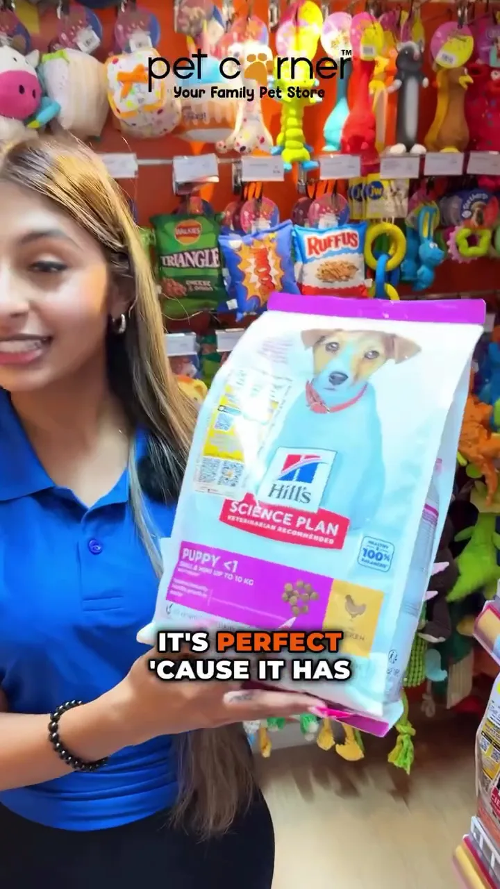 A Pet Corner team member helping a customer choose pet food in store