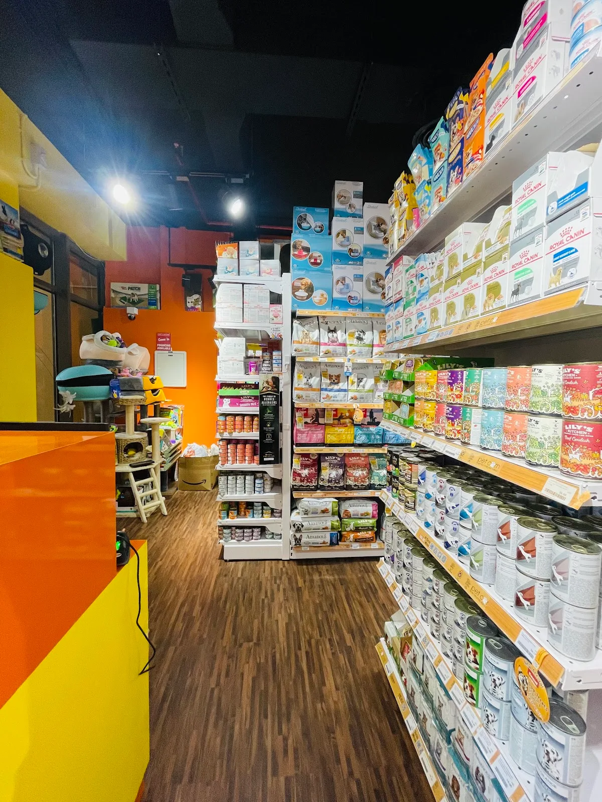 Inside Pet Corner JBR — bright aisles stocked with cat and dog food, treats and accessories