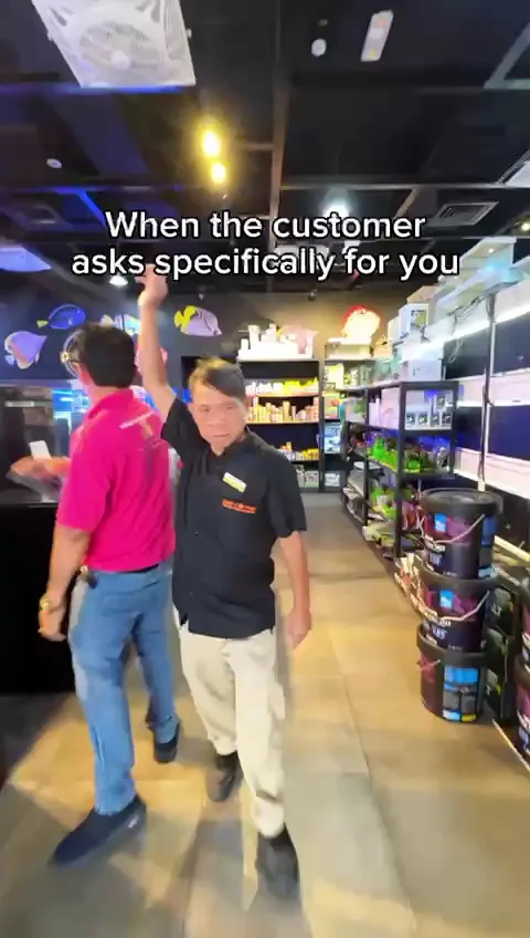 Friendly Pet Corner team member in the aquatics section